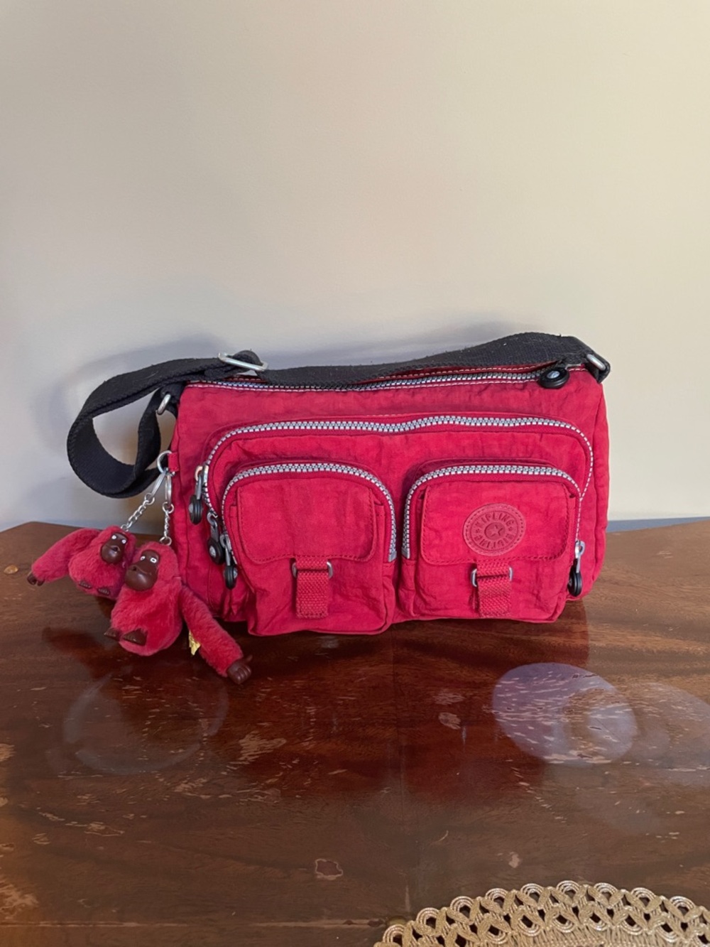 Kipling Red Crossbody with Monkey Charm and Multiple Front Pockets